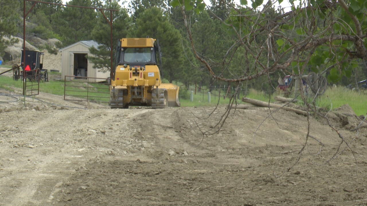 Amish assist: Roundup residents making progress on washed-out road