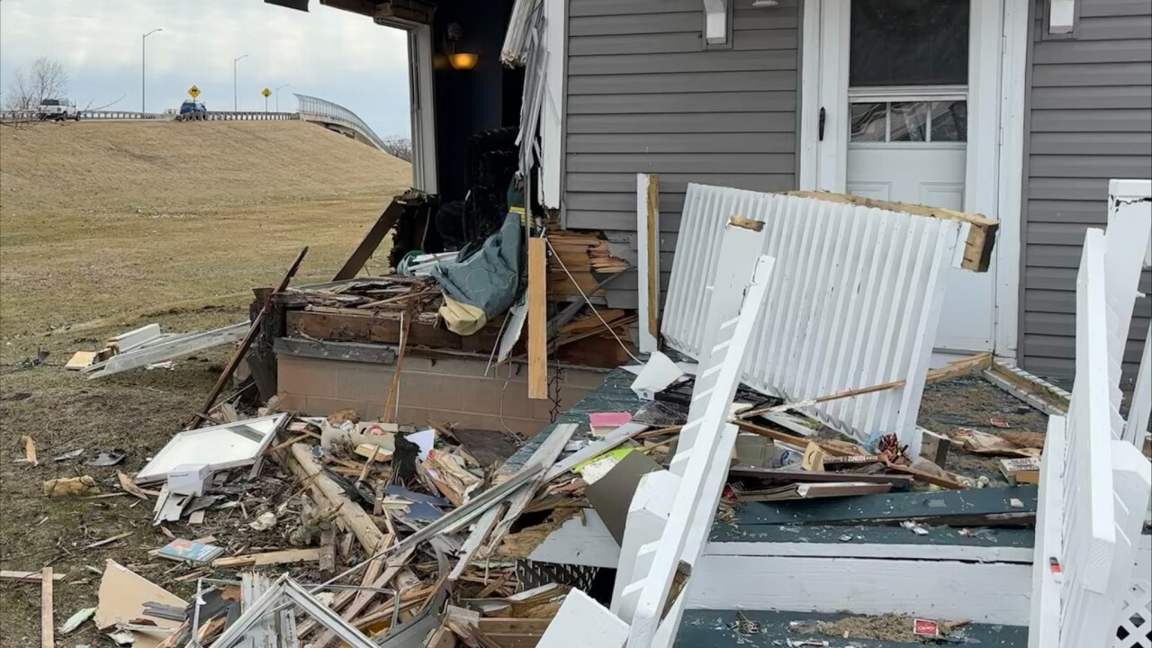 Three people injured after vehicle crashes into Neenah home