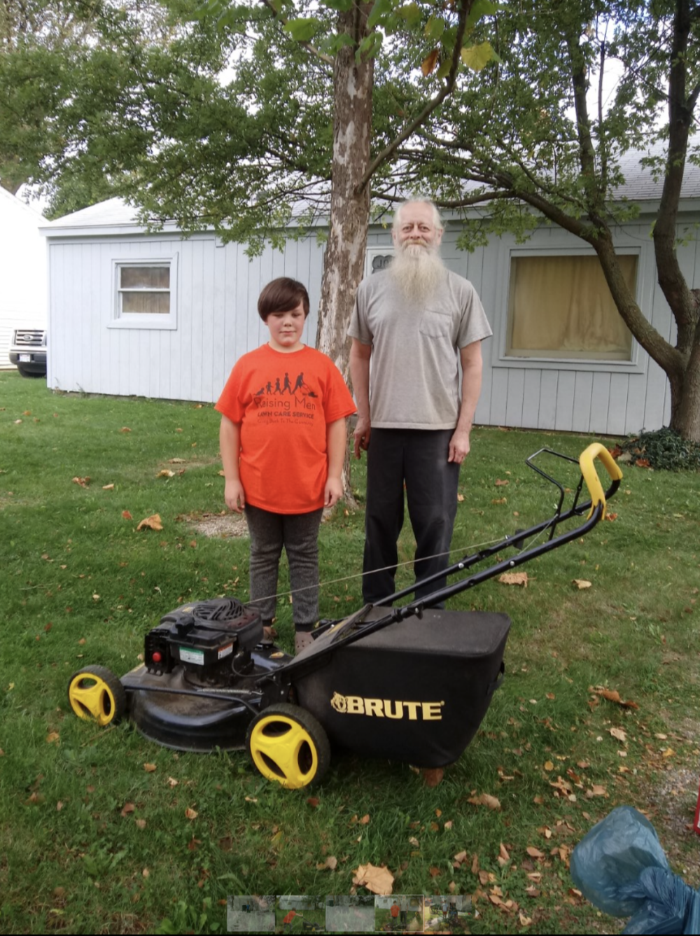 Patrick McClellan with his lawnmower and one of his "clients"