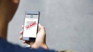 Text,Message,Sms,Scam,Or,Phishing,Concept.,Man,Hands,Using