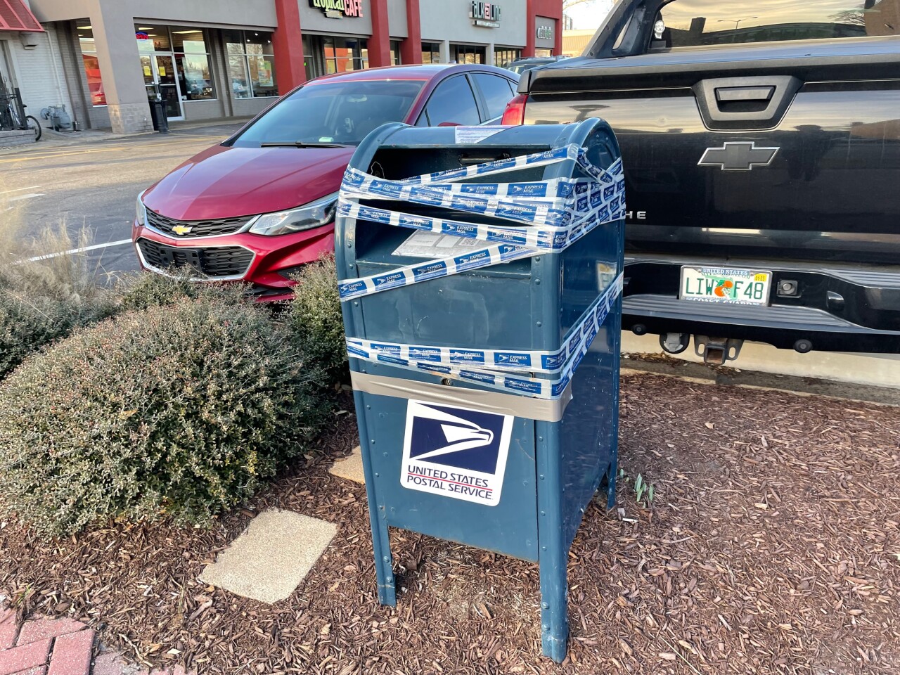 USPS collection bins taped across Hampton Roads