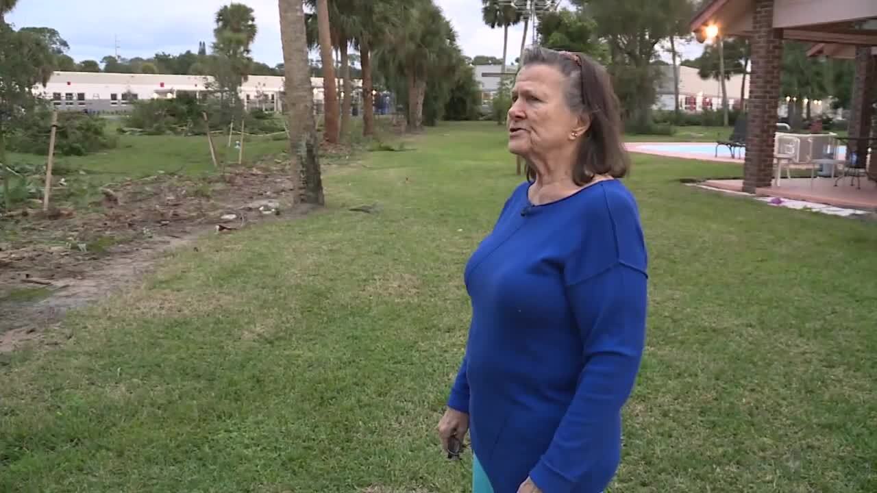 Bonnie Swink-Rineri surveys her backyard after trees were torn down by the Palm Beach County School District. Jan. 29, 2024