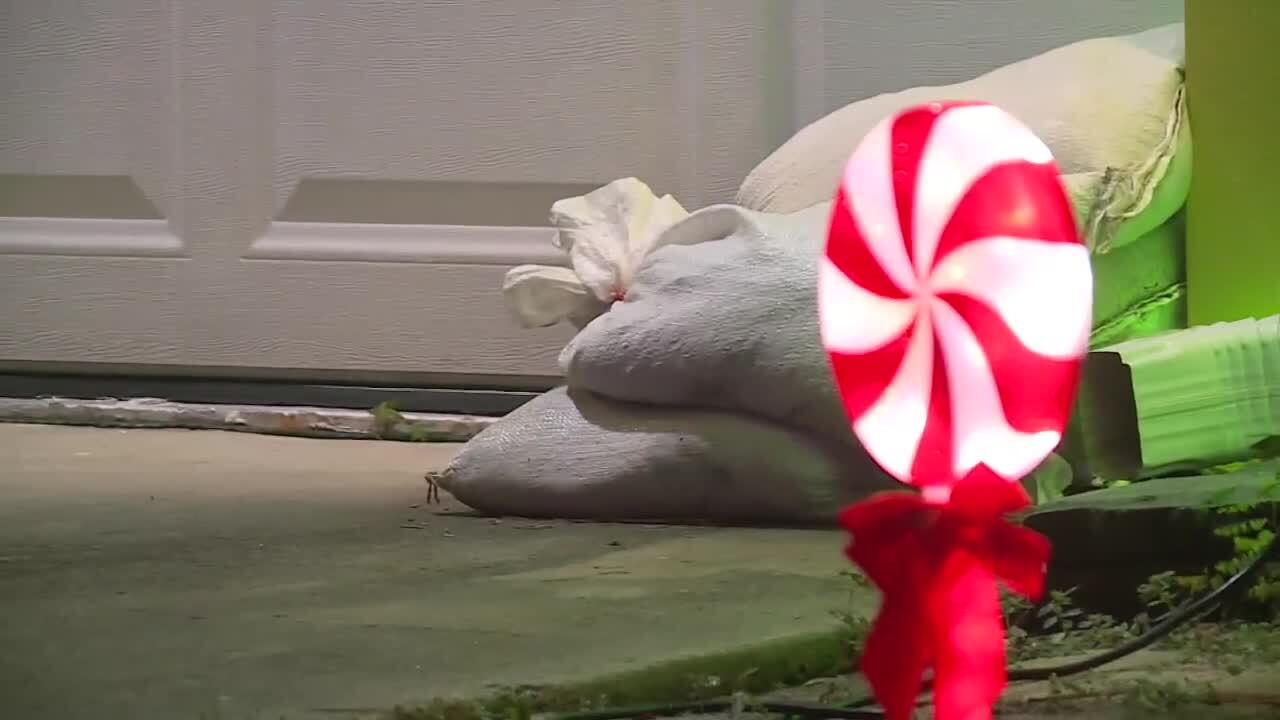 sandbags outside Lake Worth Beach home of Carlos Ramirez, Dec. 14, 2023
