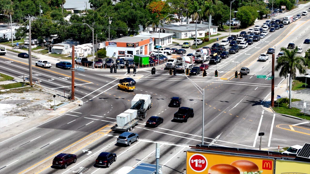Cars making a left turn on to Pondella Road from US-41.