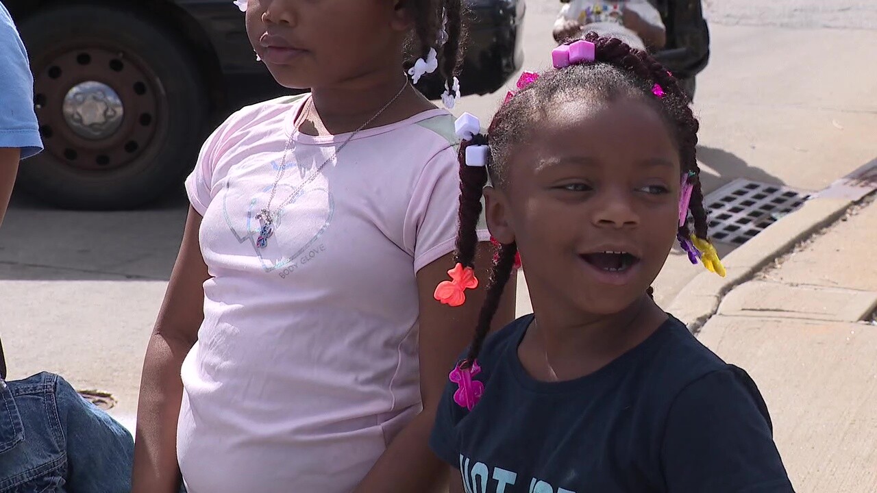 Carma, 6, watches the Labor Day parade with her cousins.