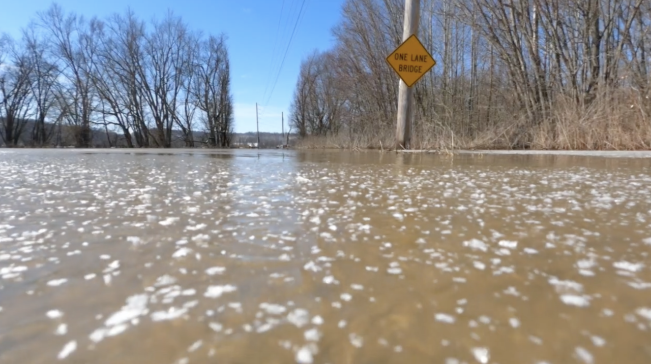 Ice and water cover a Dearborn County road
