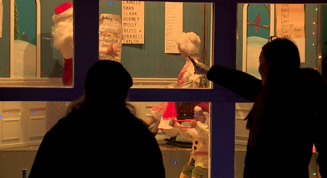 Guests looking at Santa's Workshop at the Weaver Christmas Light display