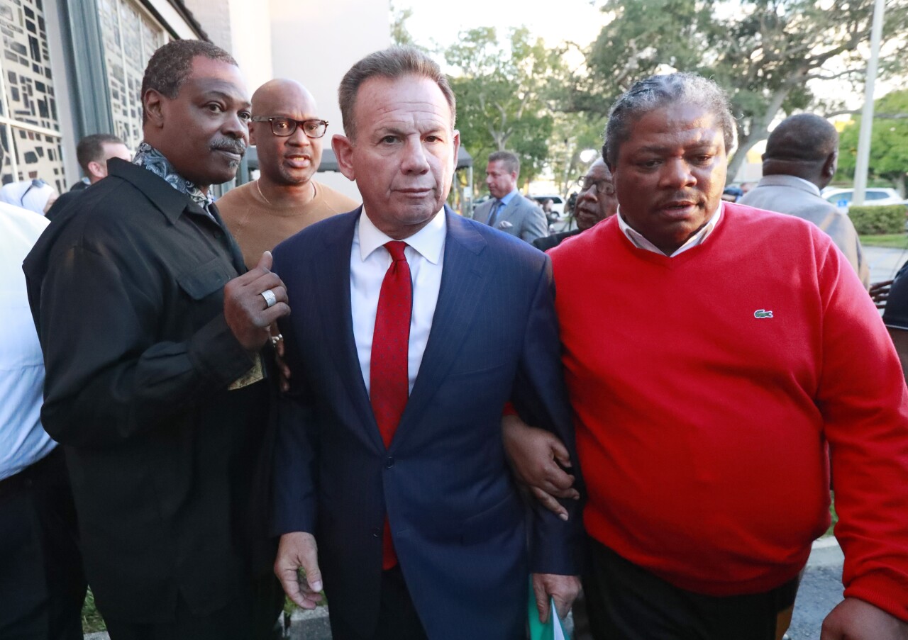 Scott Israel leaves news conference after being suspended in 2019