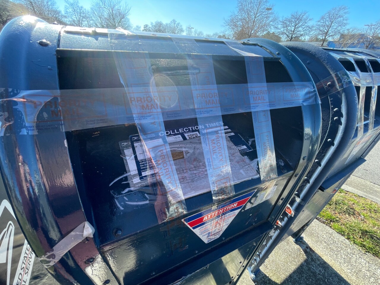 USPS collection bins taped across Hampton Roads