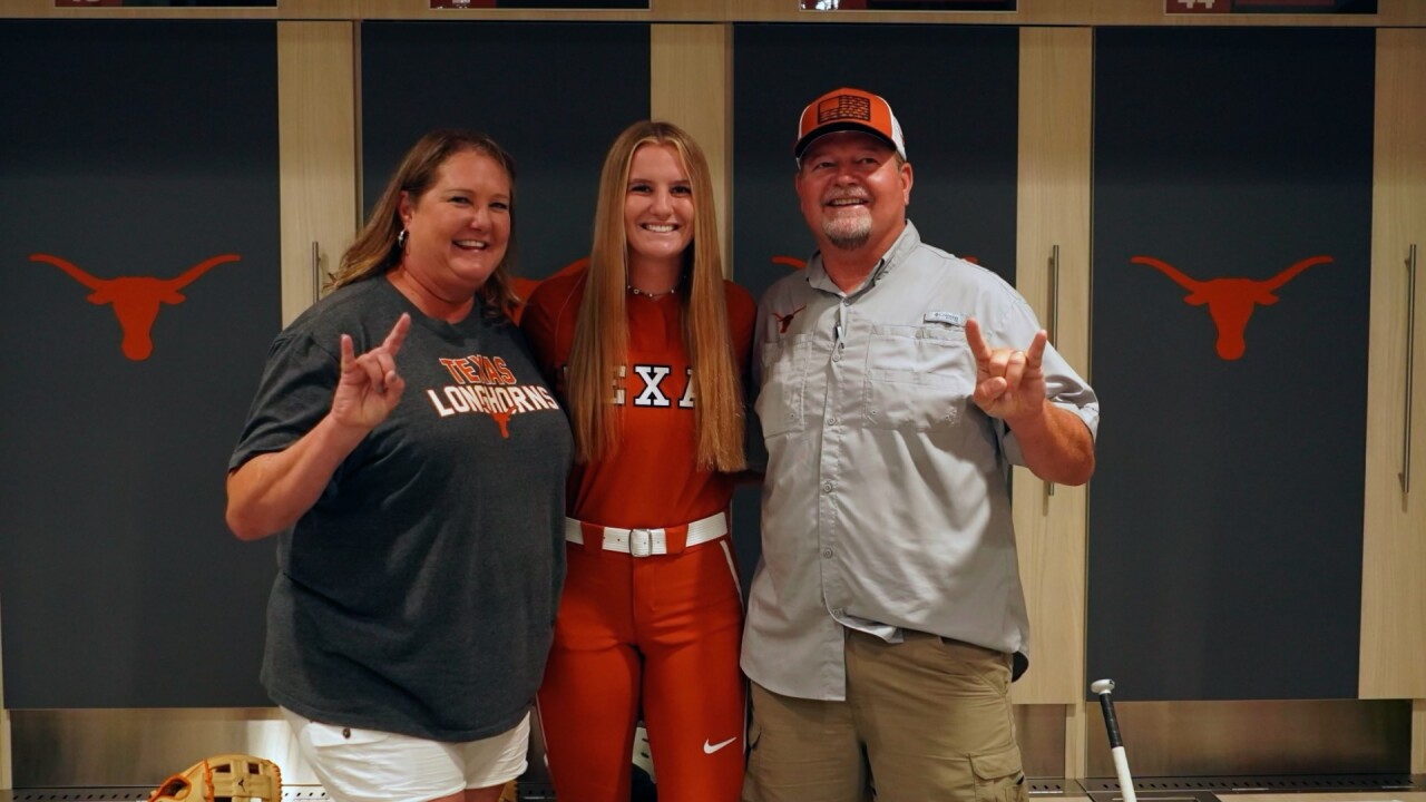 Atwood breaks Texas softball's single-season RBI record surpassing 66, historic homer hits dad in the outfield