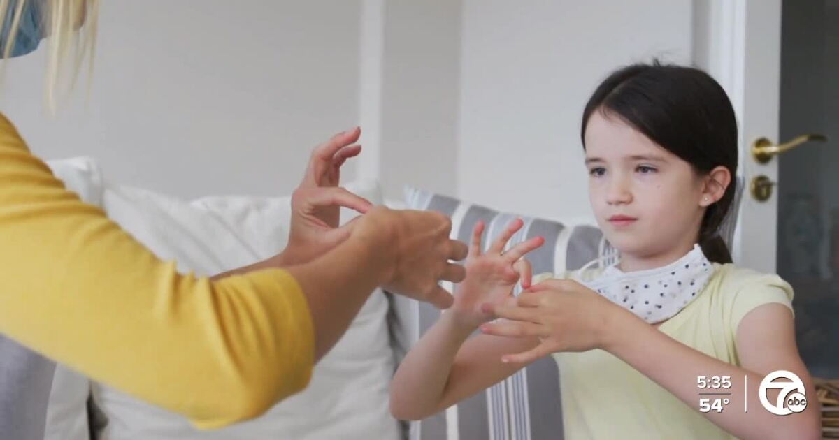 Kid Using Sign Language Parents of deaf kids push for more ASL education