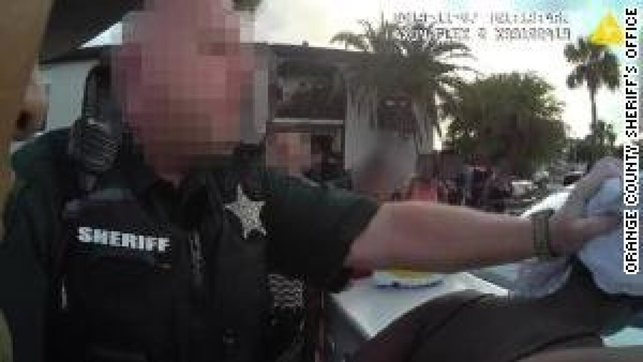 Florida school deputy grabbing girl's head