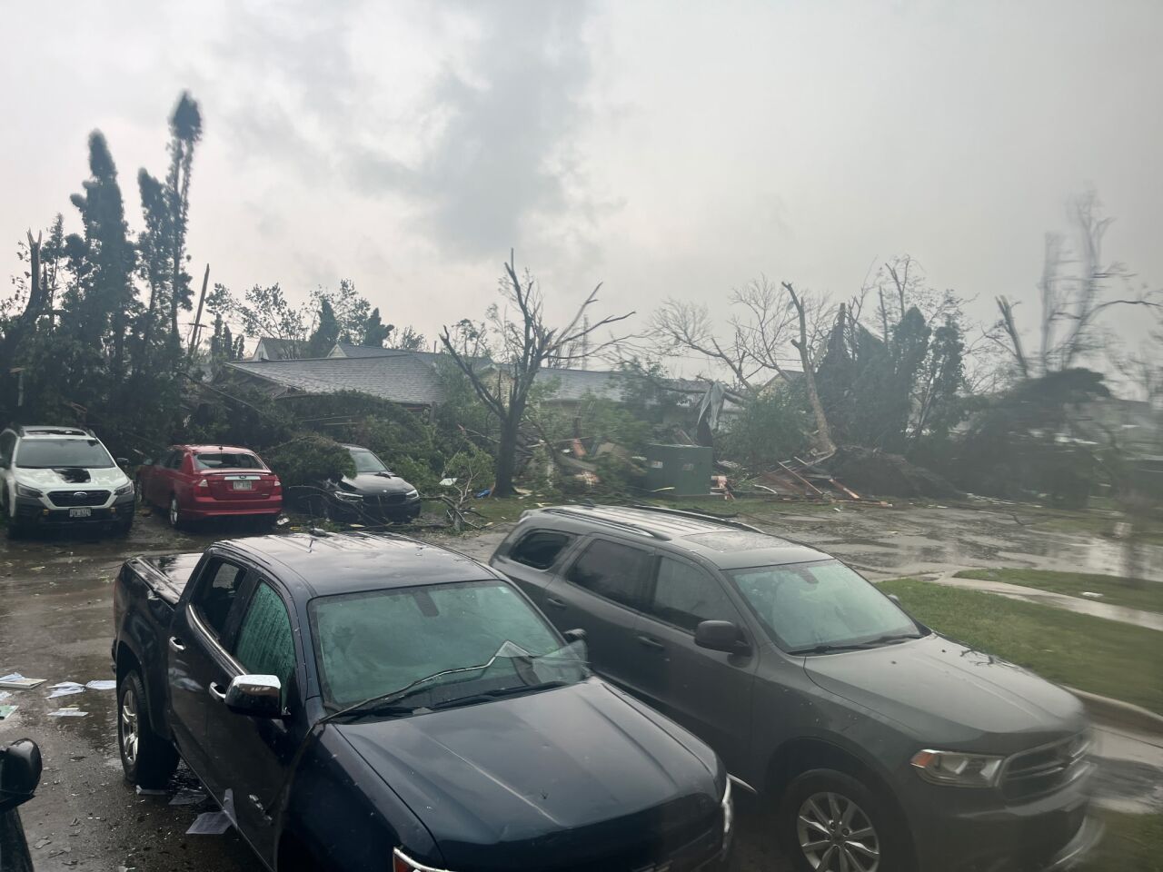 Strong winds damaged an office building on Fourth Street in Menasha Monday afternoon, blowing out windows, uprooting trees and scattering debris across the property.