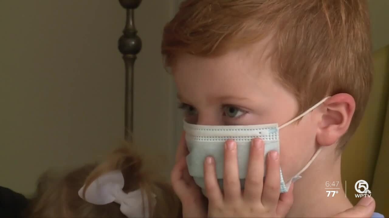 Ariel Bachman's son wears mask