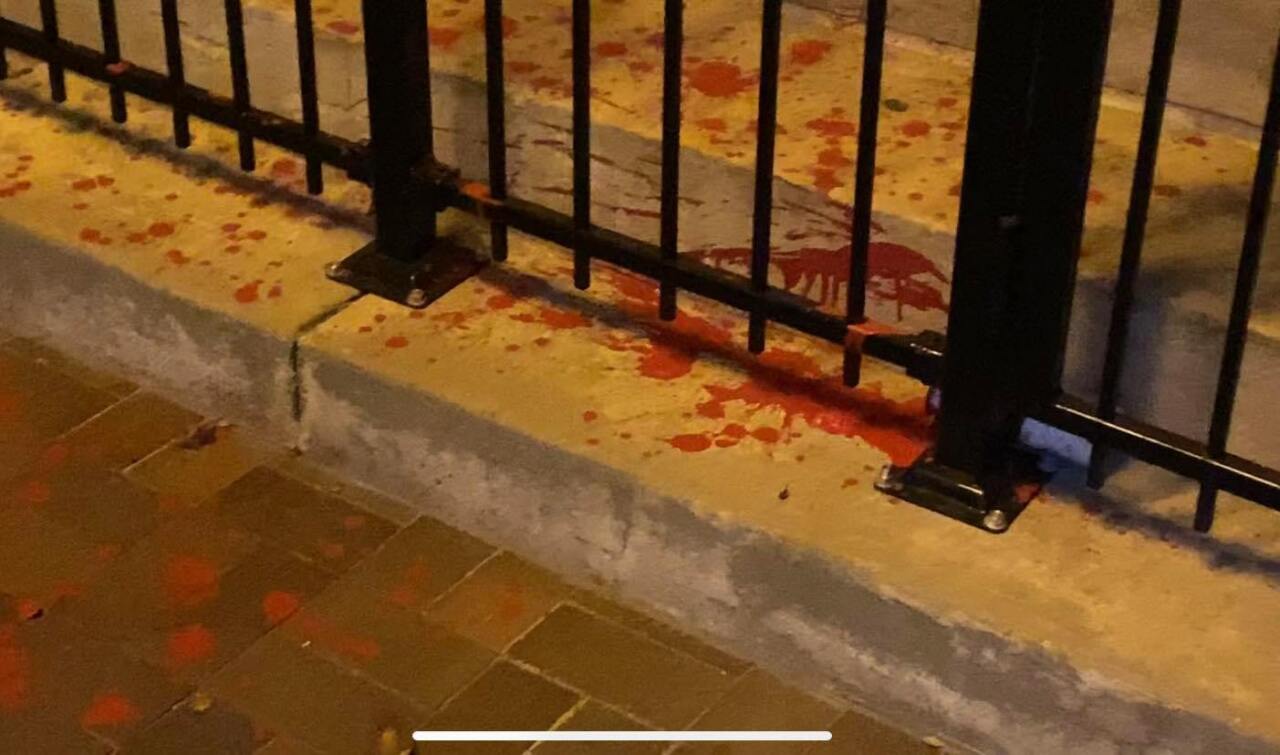 Red paint splatter seen at the base of the Christopher Columbus statue in Pueblo on Sunday morning.