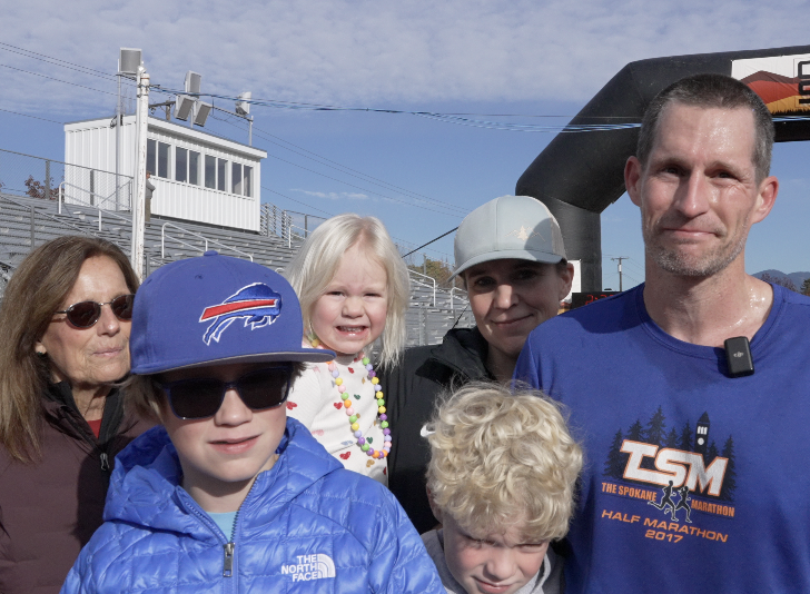 The Vaughn family celebrates dad, Tim, at the finish line for his third place finish in the 25K trail race.