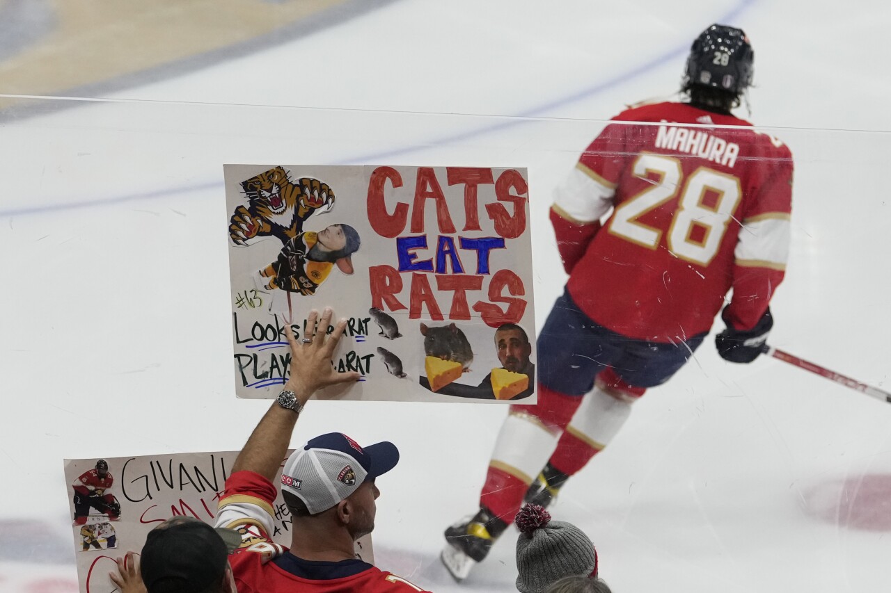 Florida Panthers fan holds 'Cats Eat Rats' sign before Game 3 of NHL first-round playoff series against Boston Bruins, April 21, 2023