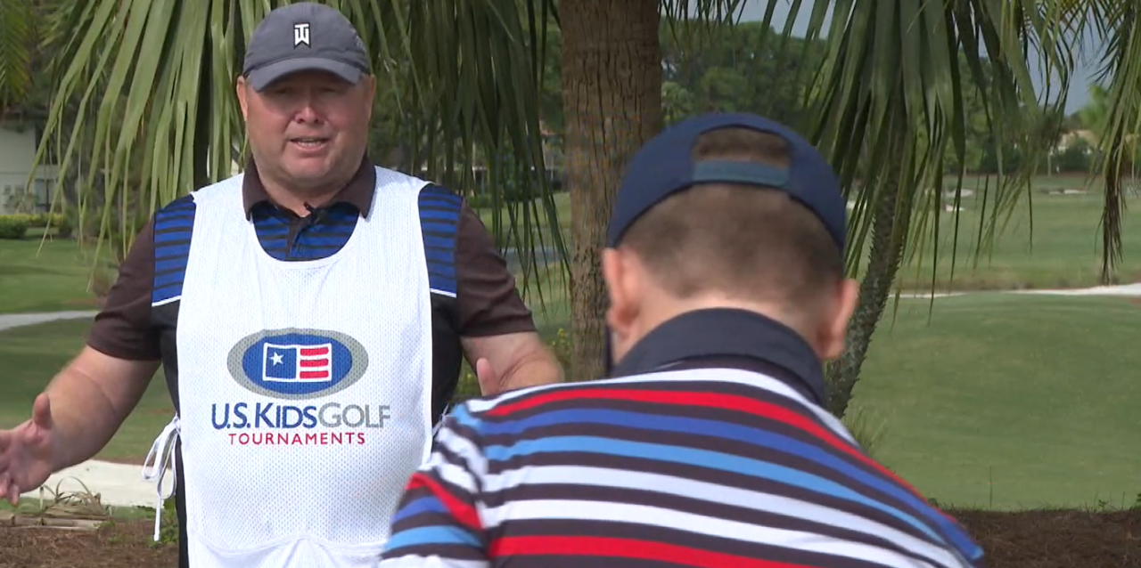 Brian Kelley Sr., of Port St. Lucie caddies for his son. Dec. 23, 2023
