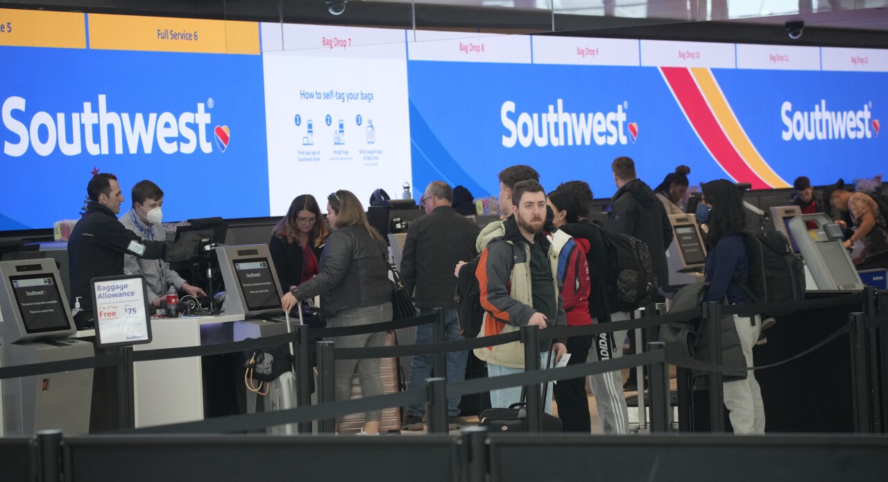 Southwest Airlines customers at check-in counters in Denver, Dec. 30, 2022