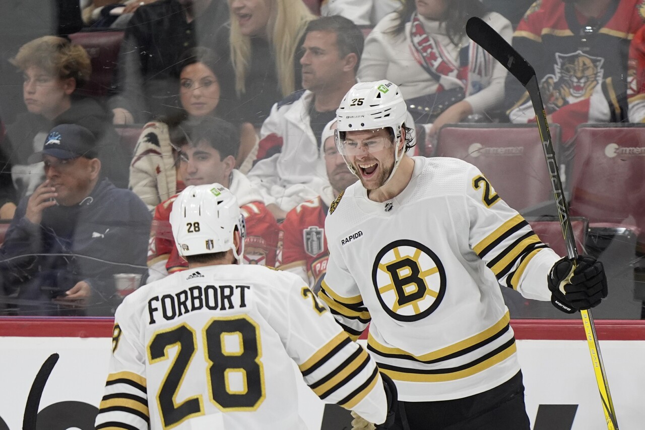 Boston Bruins defenseman Brandon Carlo celebrates his goal with defenseman Derek Forbort during second period of playoff series opener, May 6, 2024