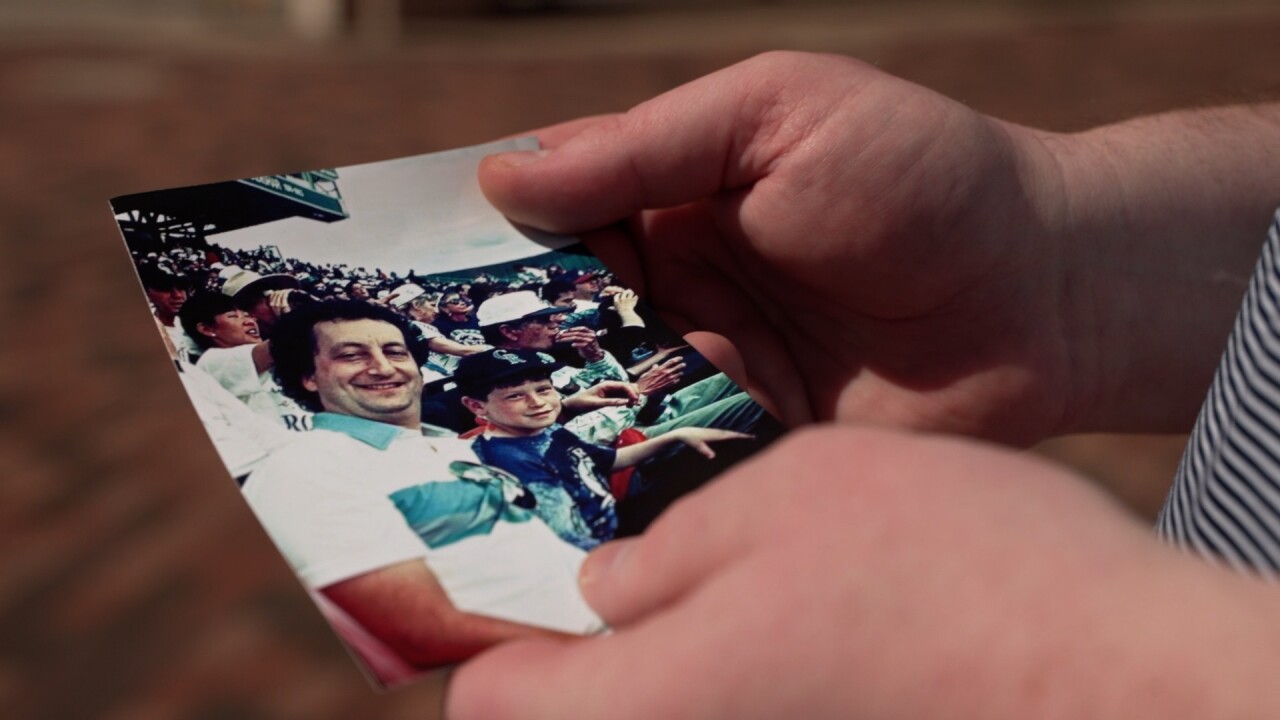 Dan Fellman holding picture.jpg