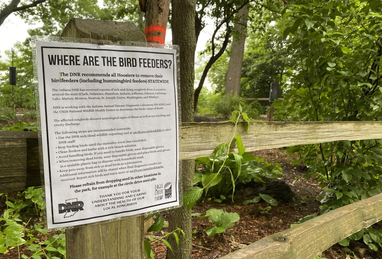 Signs at Eagle Creek Park are posted to explain why the bird feeders are gone.