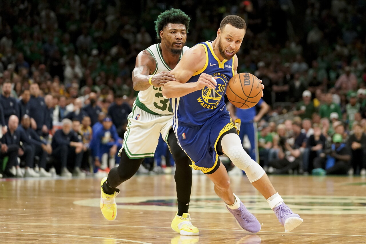 Golden State Warriors guard Steph Curry drives against Boston Celtics guard Marcus Smart in Game 6 of 2022 NBA Finals