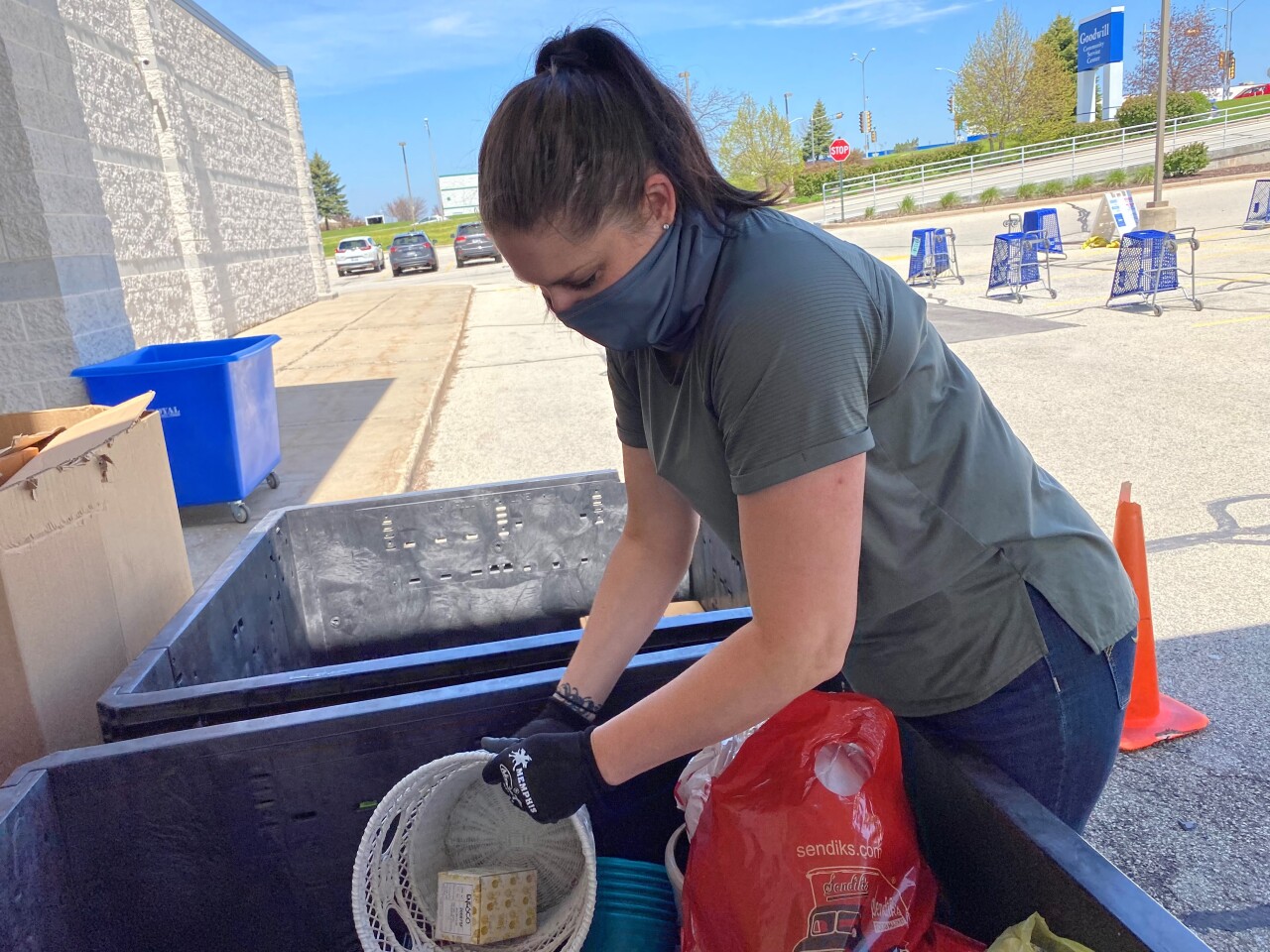 Waukesha_Store_2 - Jessica Smith-donation attendant.jpg
