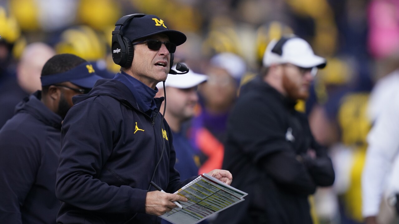 Ex-college football staffer says Big Ten team had Wolverines' signs