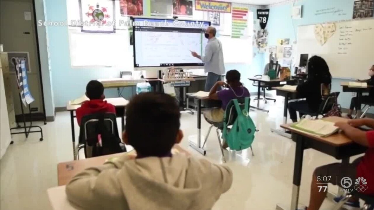 A teacher and students wear face masks inside a Palm Beach County classroom during the 2020_21 school year.jpg