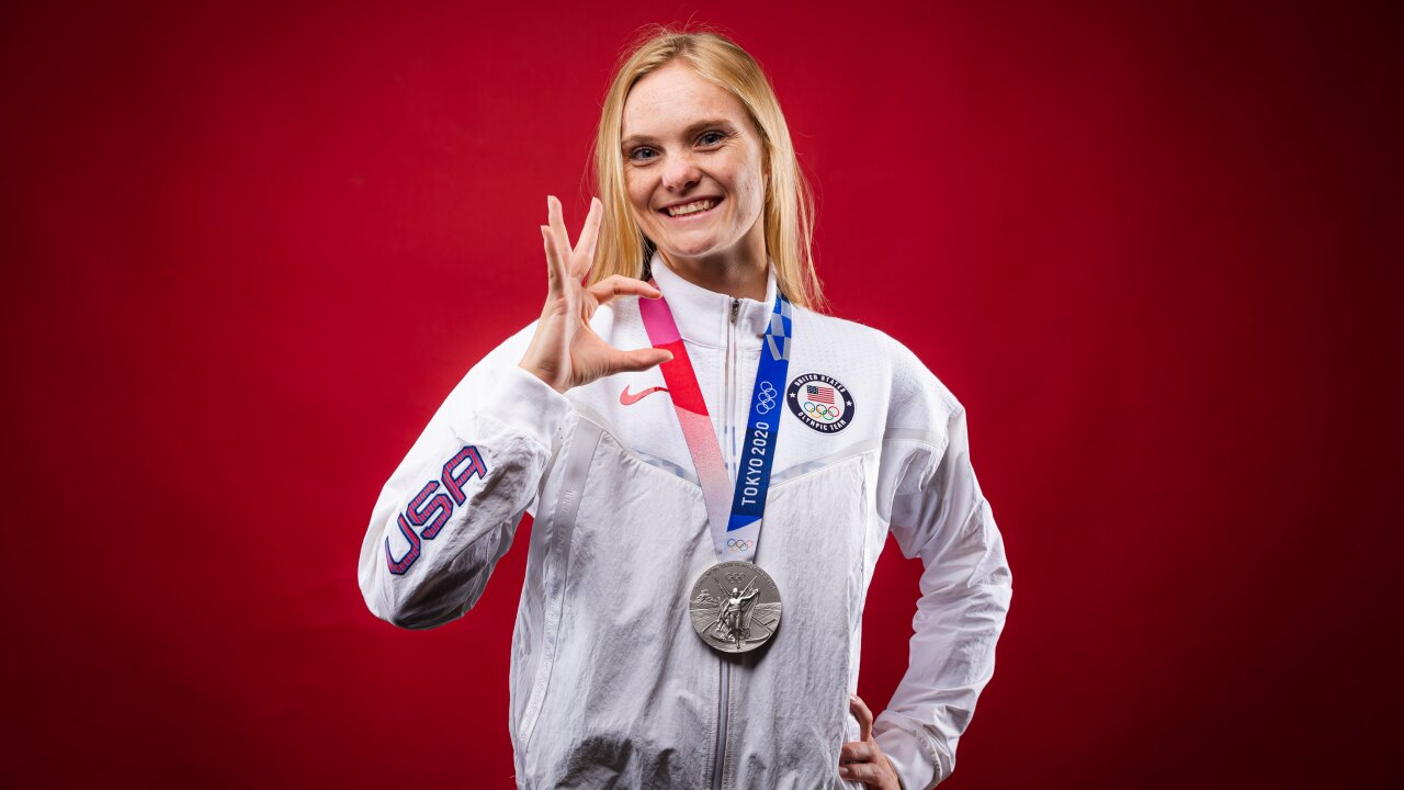 Delaney Schnell making the Wildcat sign with her silver medal