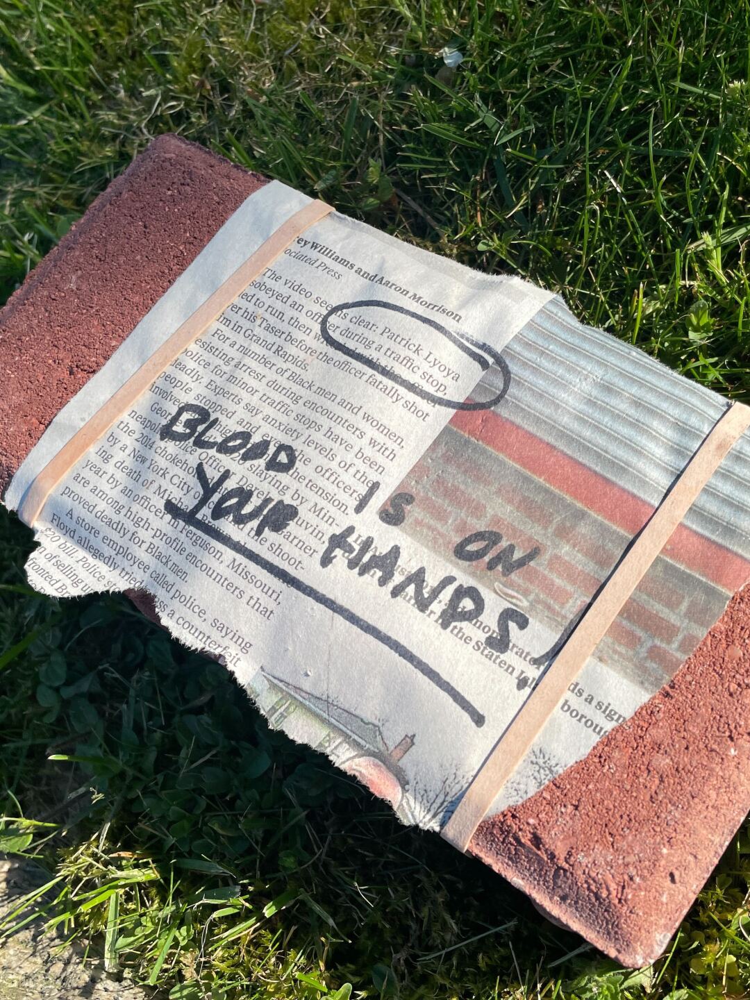 A brick left on the lawn of Commissioner Jon O'Connor