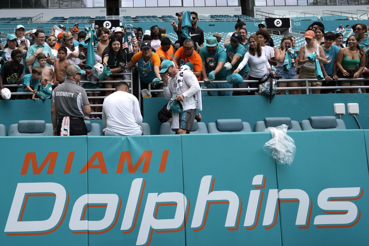 Miami Dolphins QB Tua Tagovailoa signs autographs for fans after team scrimmage at Hard Rock Stadium, Aug. 5, 2023