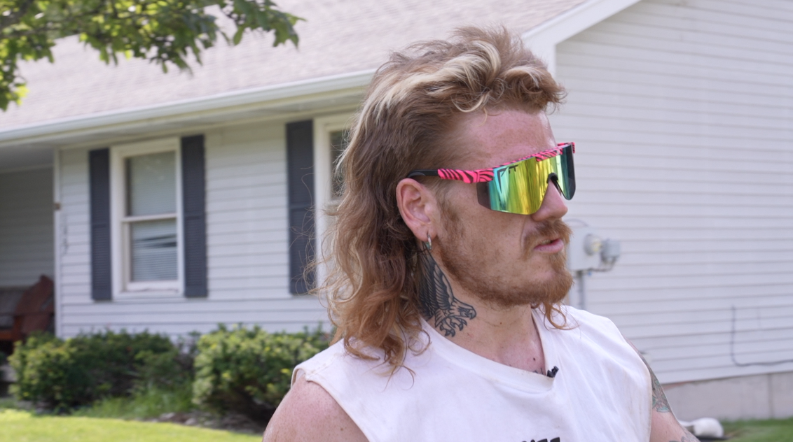 Guy with a mullet landscaping