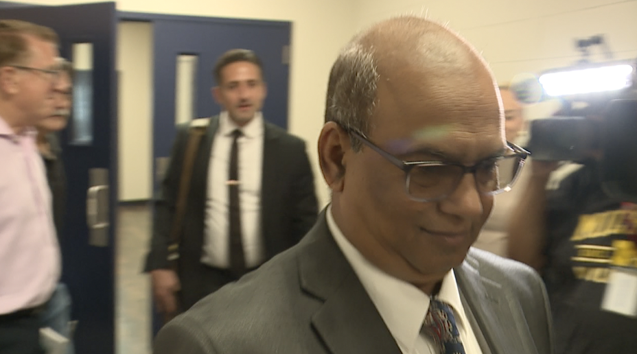 Mohammed Hassan leaving the courtroom with his attorney