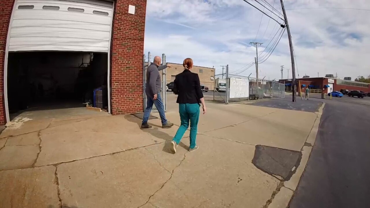 John Balogh, left, shows off the parking lot at Total Quality Testing Inc. in Brook Park to News 5 reporter Michelle Jarboe.