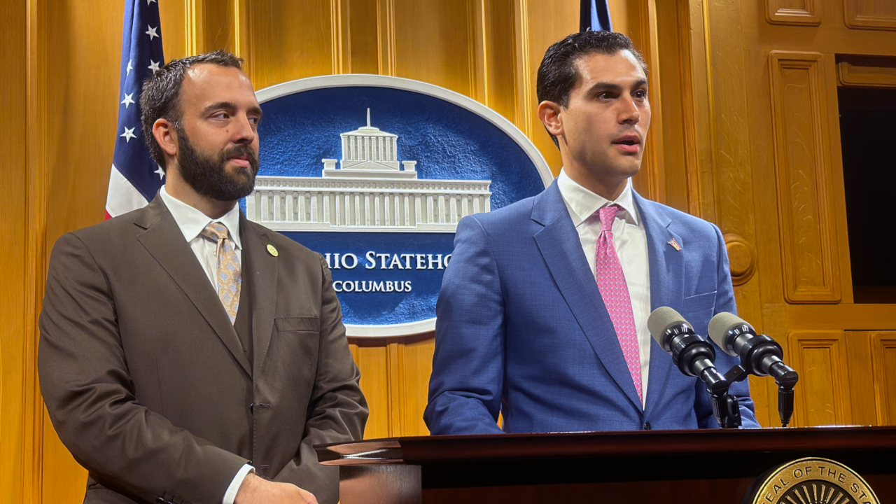 State Rep. Adam Mathews (R-Lebanon) standing with House Minority Leader Dani Isaacsohn (D-Cincinnati)
