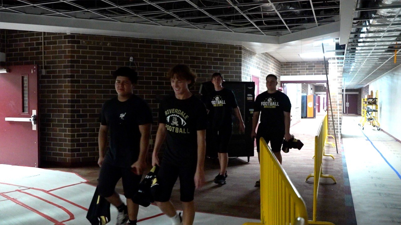 Riverdale High School athletes walking down a primary walkway.