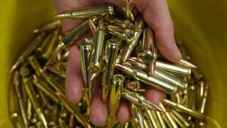 A bucket full of ammunition.