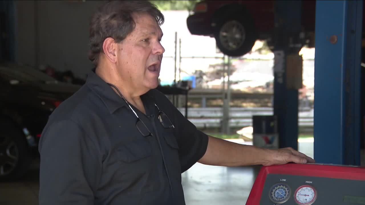 Angel Borges, of Angel Auto Care in West Palm Beach, says lots of drivers complain about car air-conditioning in summer heat, Aug. 14, 2023
