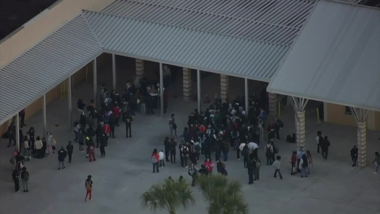 Students appear to walk through metal detectors at Palm Beach Central High School in Wellington on Feb. 1, 2024.jpg