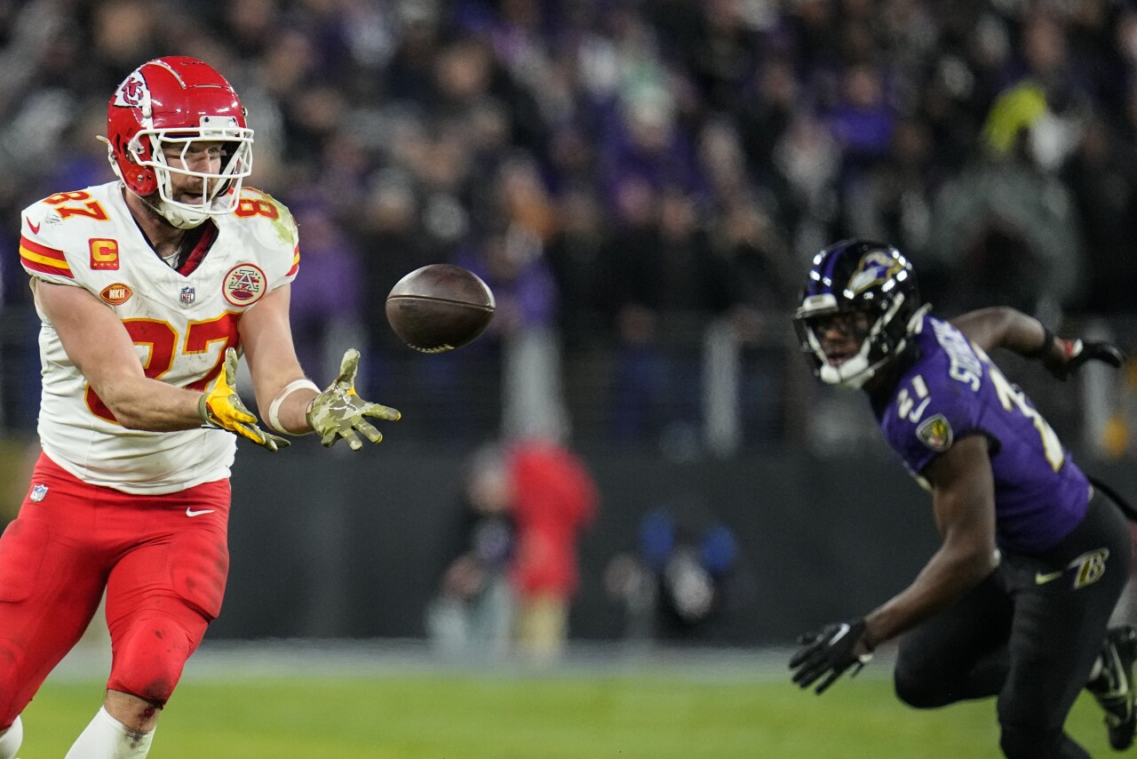 Kansas City Chiefs tight end Travis Kelce prepares to make catch at Baltimore Ravens in second half of AFC Championship, Jan. 28, 2024
