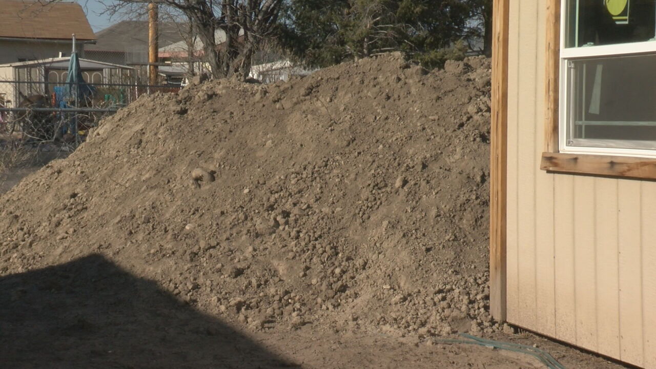 Dirt piles outside the Dunn family home 