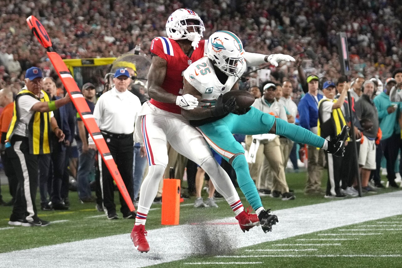 Miami Dolphins cornerback Xavien Howard intercepts pass intended for New England Patriots receiver DeVante Parker in third quarter, Sept. 17, 2023