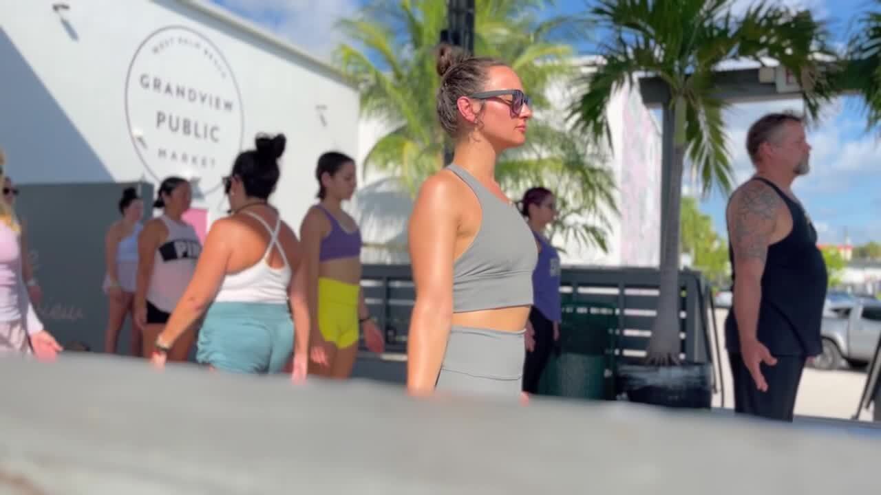 Maki Criscaut teaches community yoga class at Grandview Public Market, Aug. 6, 2023