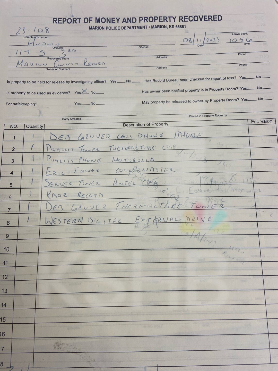 Warrant at newspaper.jpg