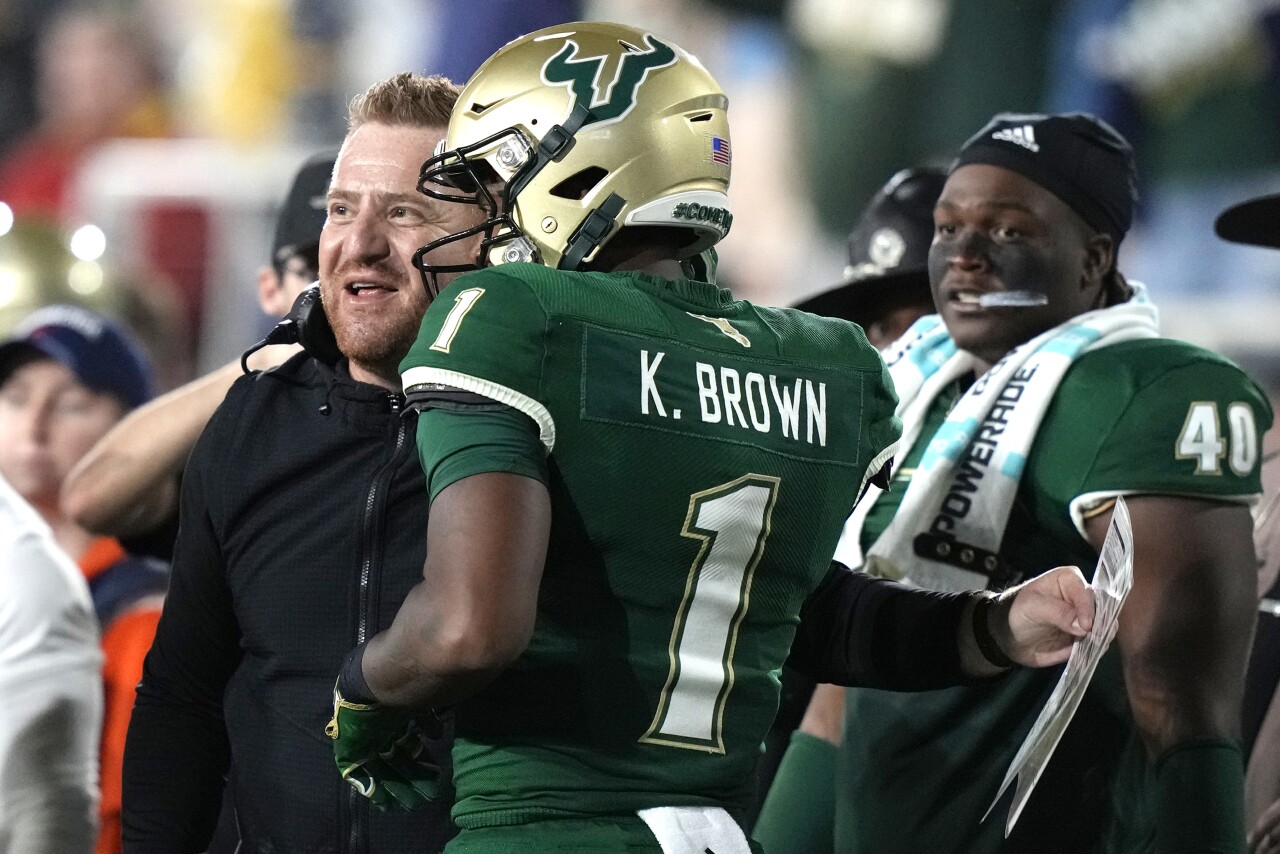 South Florida Bulls head coach Alex Golesh speaks to receiver Khafre Brown after his TD in second quarter of 2023 Boca Raton Bowl