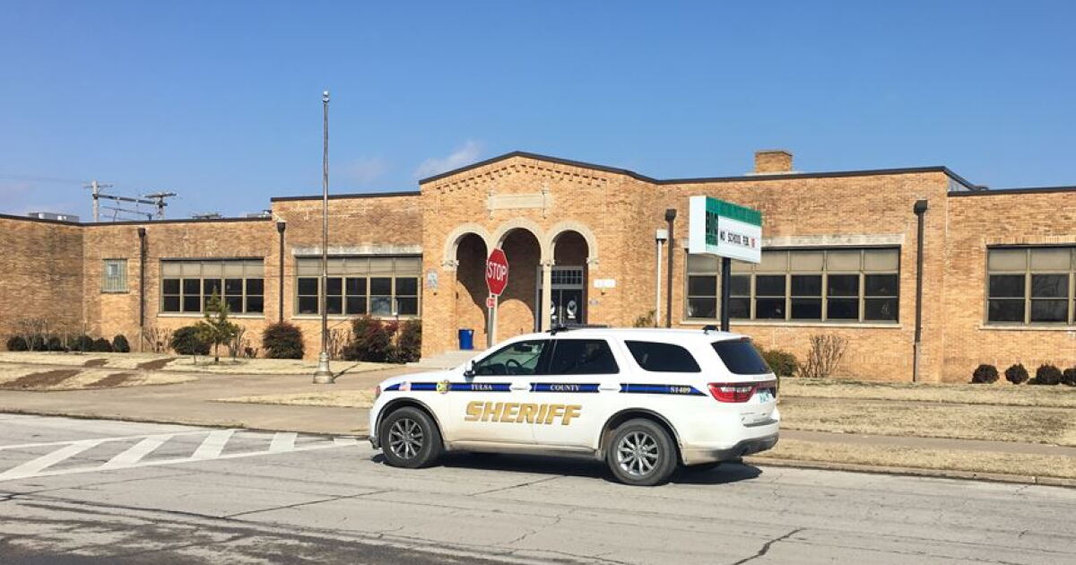 Man arrested after chase, getting on top of roof of school
