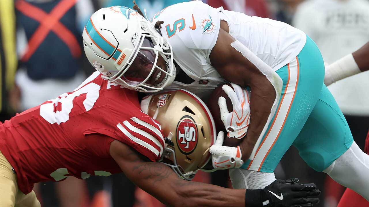 Miami Dolphins running back Jaylen Wright (5) is hit by San Francisco 49ers safety Marques Sigle during the first half of an NFL football game in Santa Clara, Calif., Sunday, Sept. 20, 2026. (AP Photo/Jed Jacobsohn)
