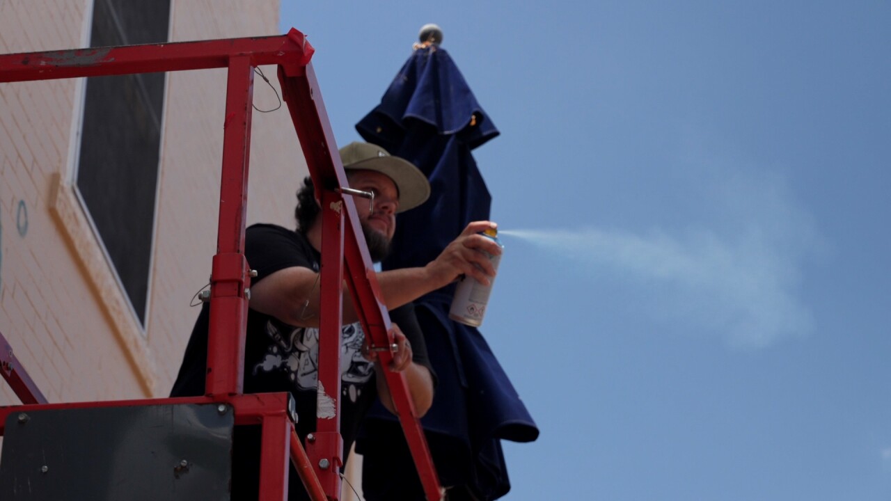 Maxcy getting ready to work on mural.jpg